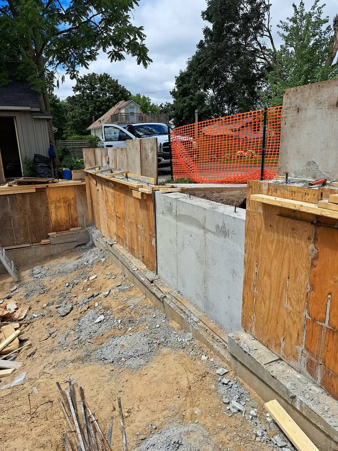 Poured concrete foundation walls with plywood forms on a residential build