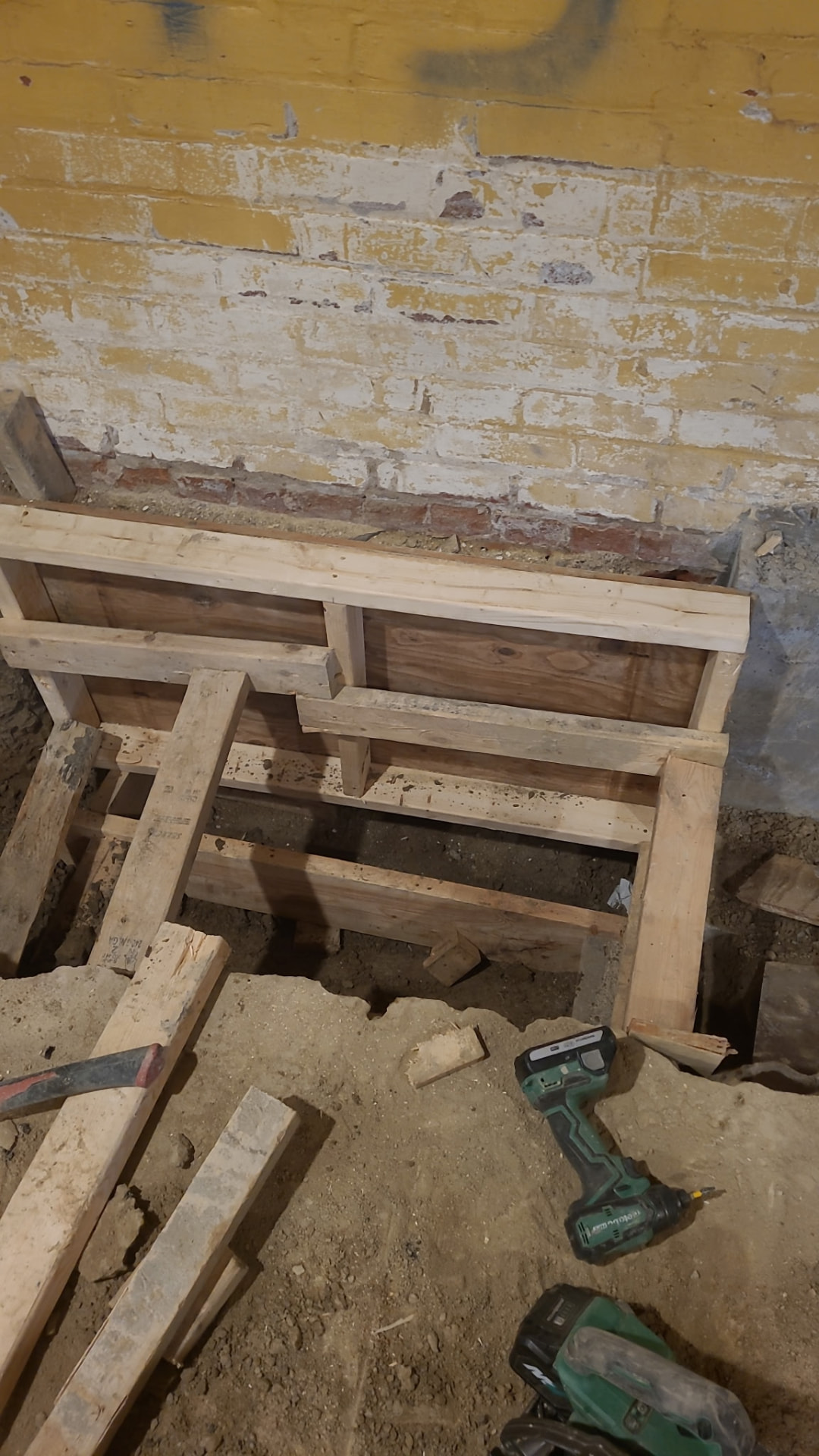 Timber shoring and forms set in place for a sequenced underpinning section